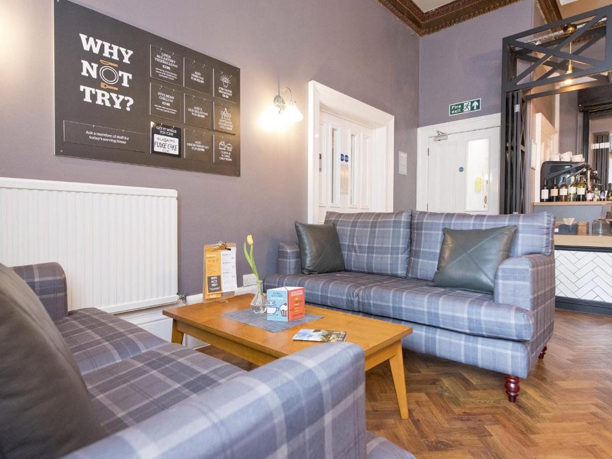 a living room with two couches and a coffee table at YHA Bath in Bath